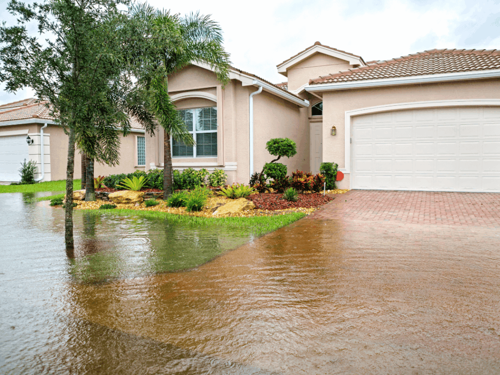 Florida home with standing floodwater in front yard after heavy rain